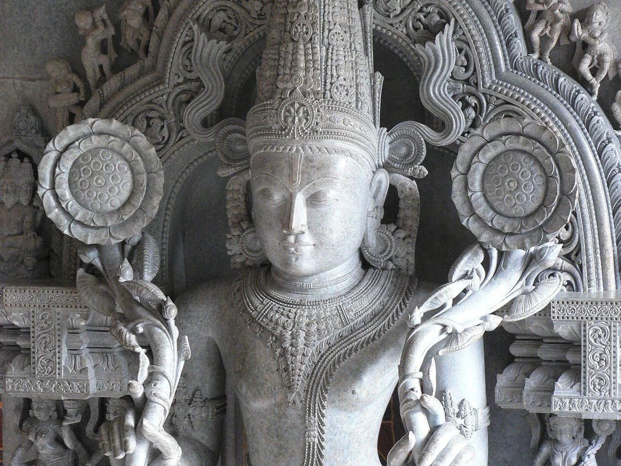 An intricately carved stone deity inside an Indian temple
