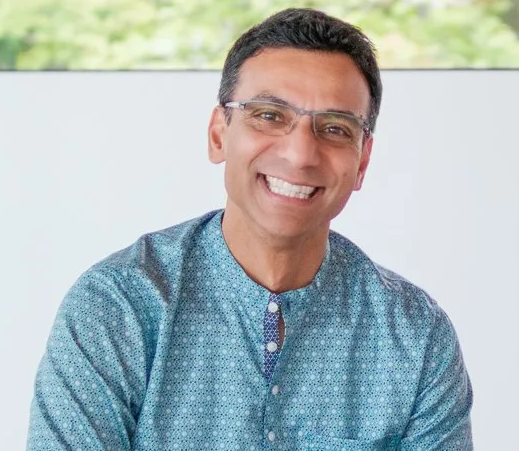 Raj Patra smiling in a blue patterned kurta